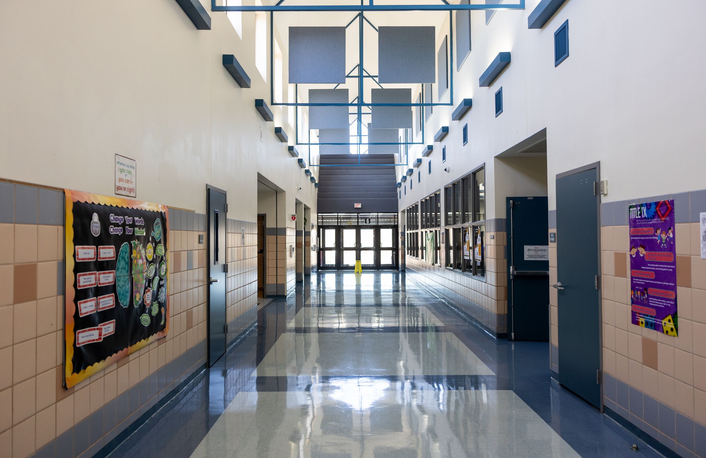 Bright school hallway with reflective education flooring