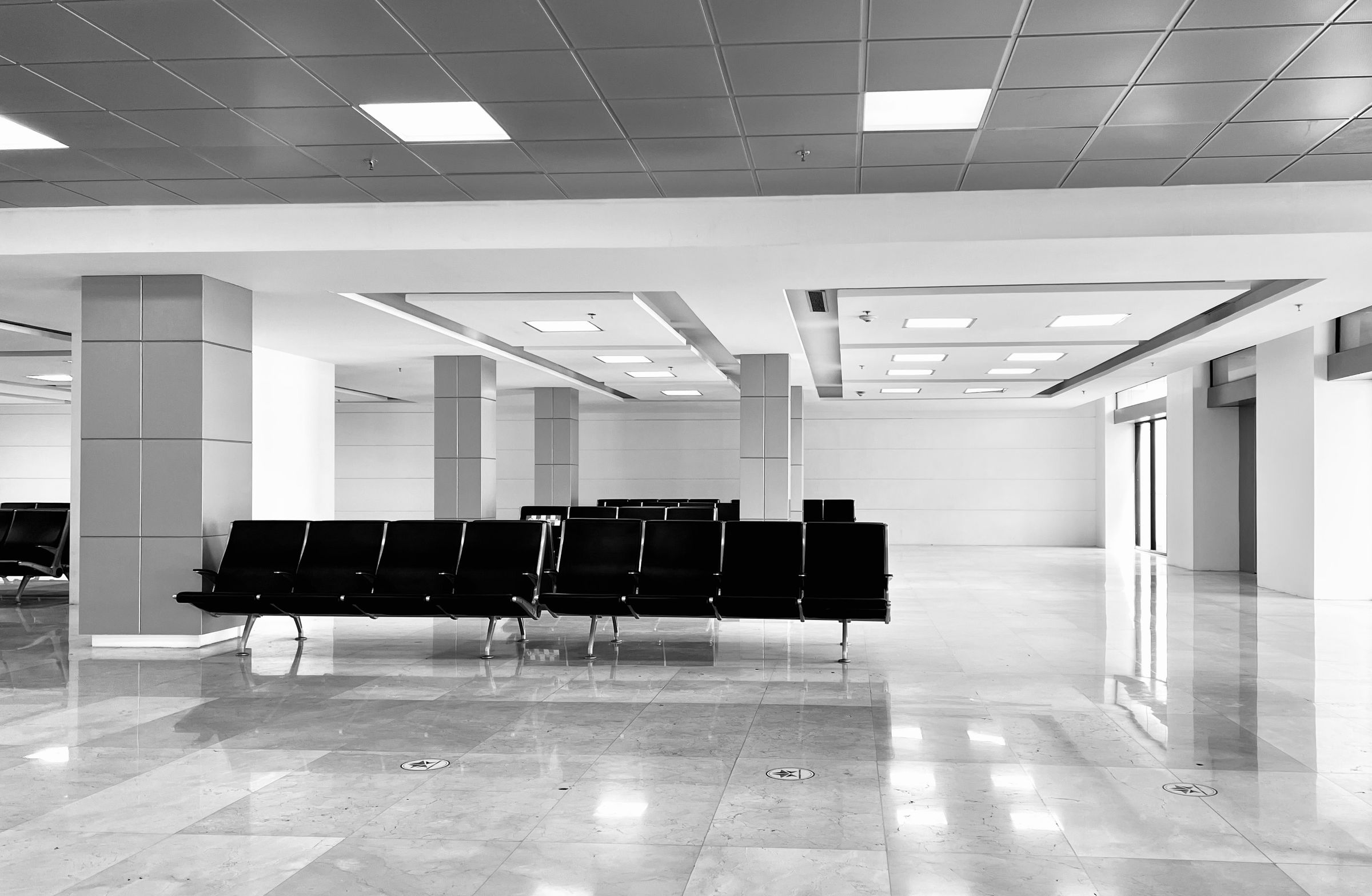 Commercial waiting area with white tile flooring