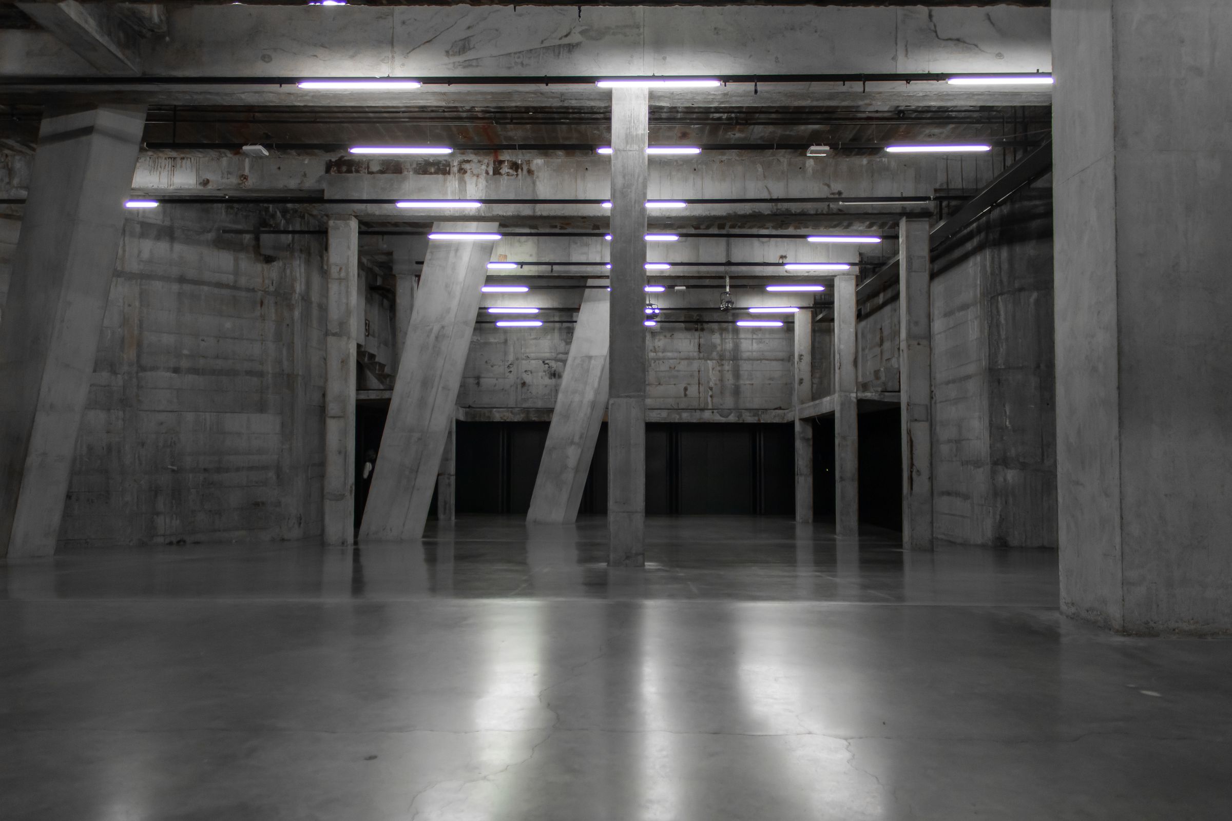 Empty concrete hall used for epoxy and polished concrete comparison