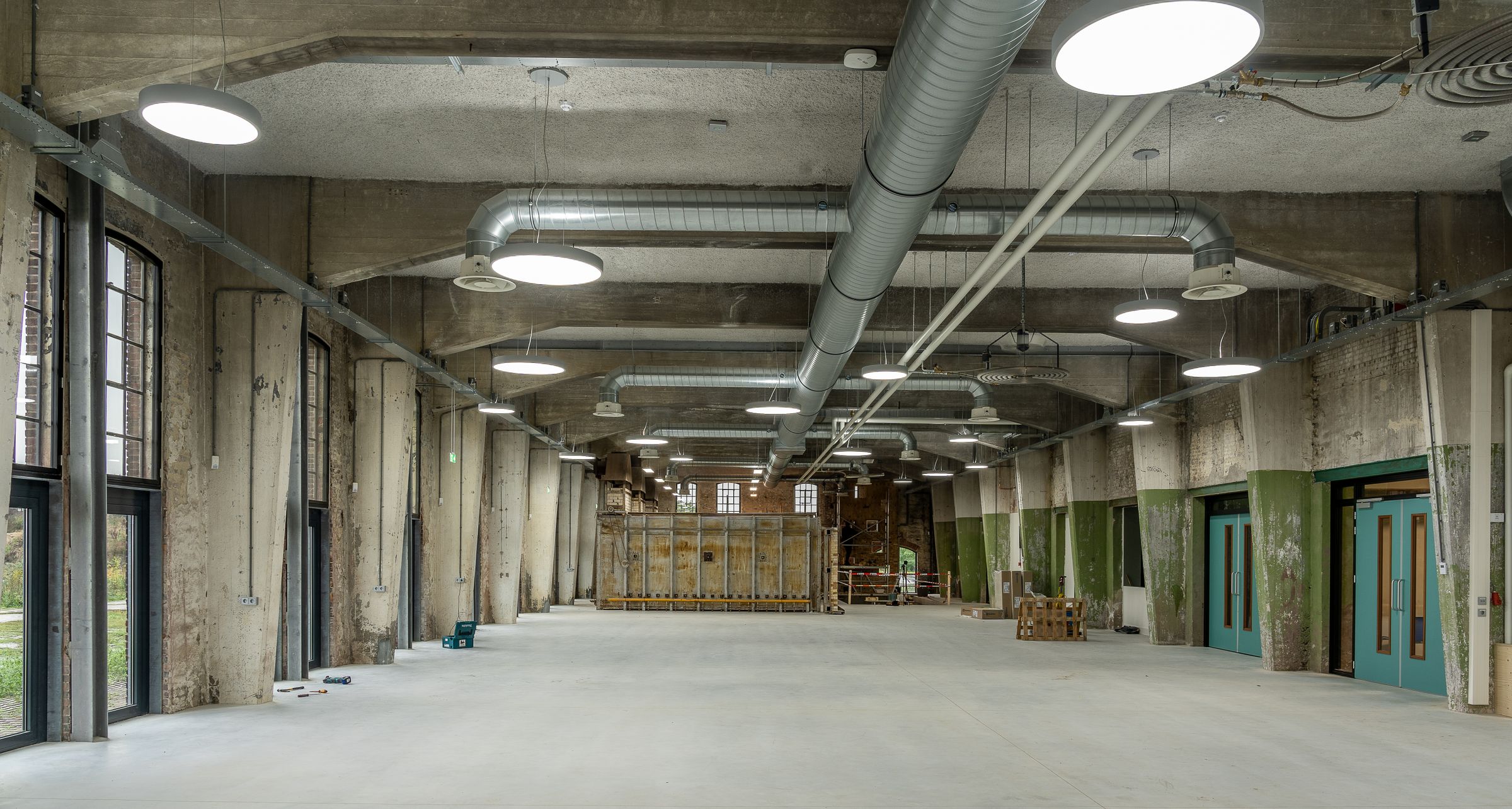 Empty concrete warehouse interior for epoxy and polished concrete planning