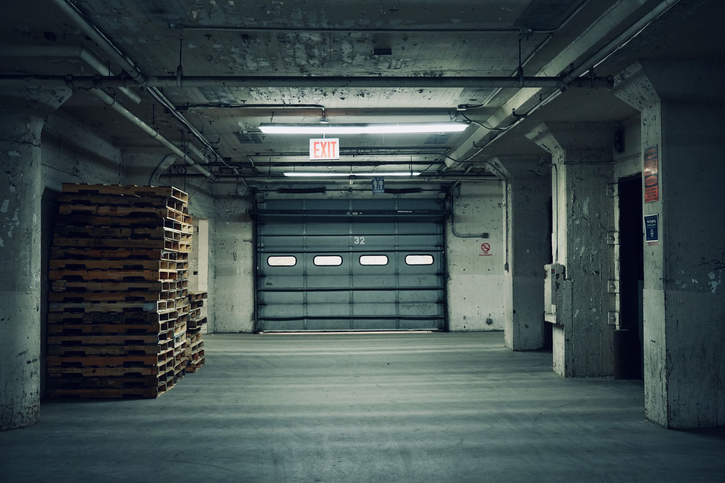 Empty industrial warehouse with concrete flooring