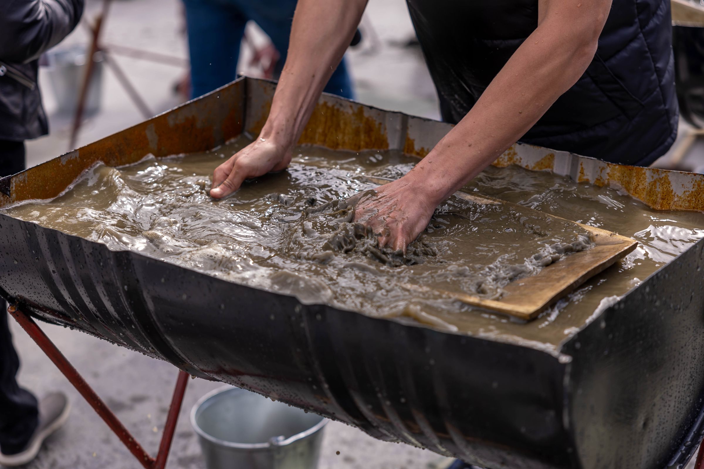 Concrete slurry being mixed for floor preparation work