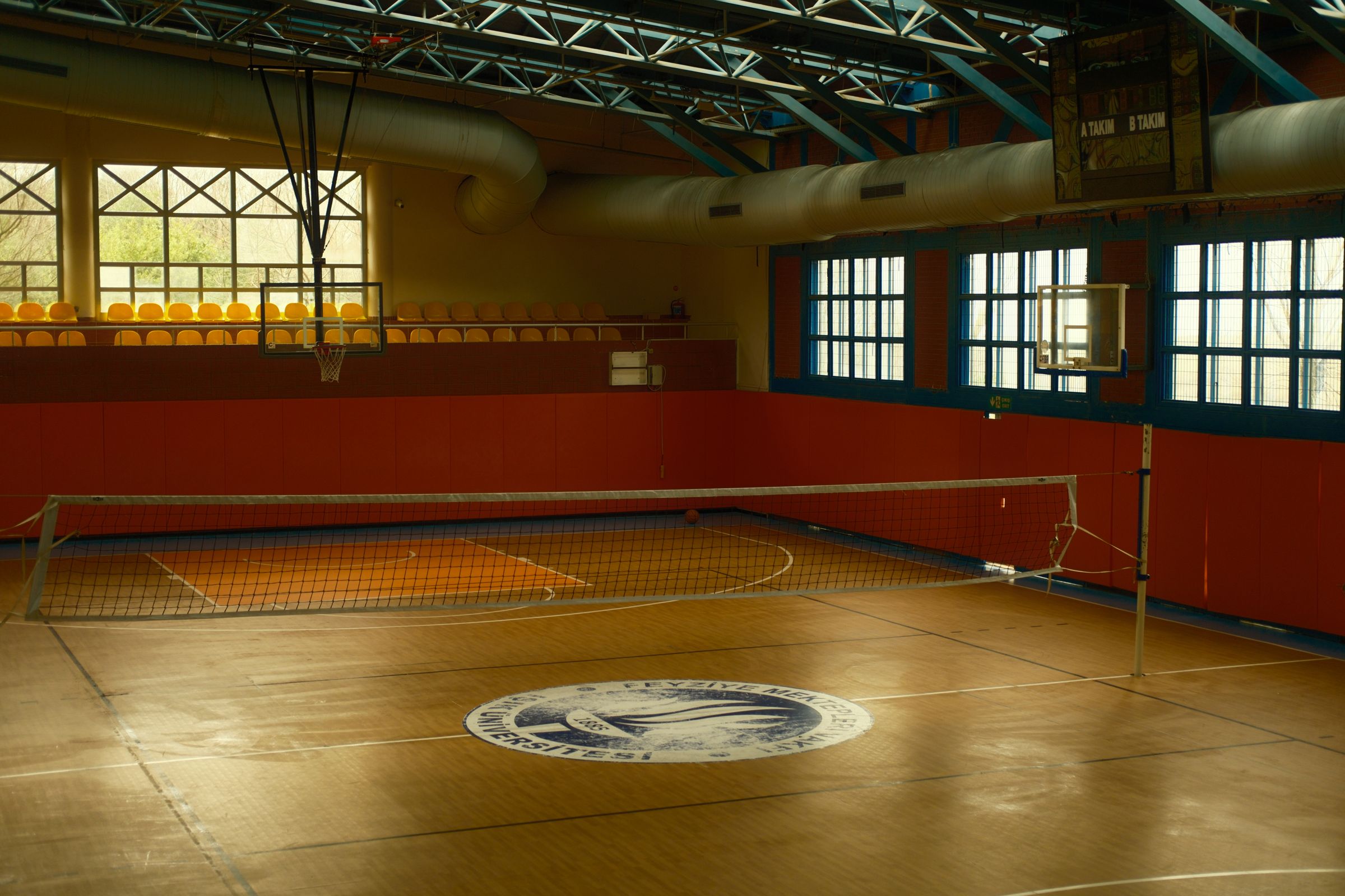Indoor sports arena with hardwood athletic facility flooring