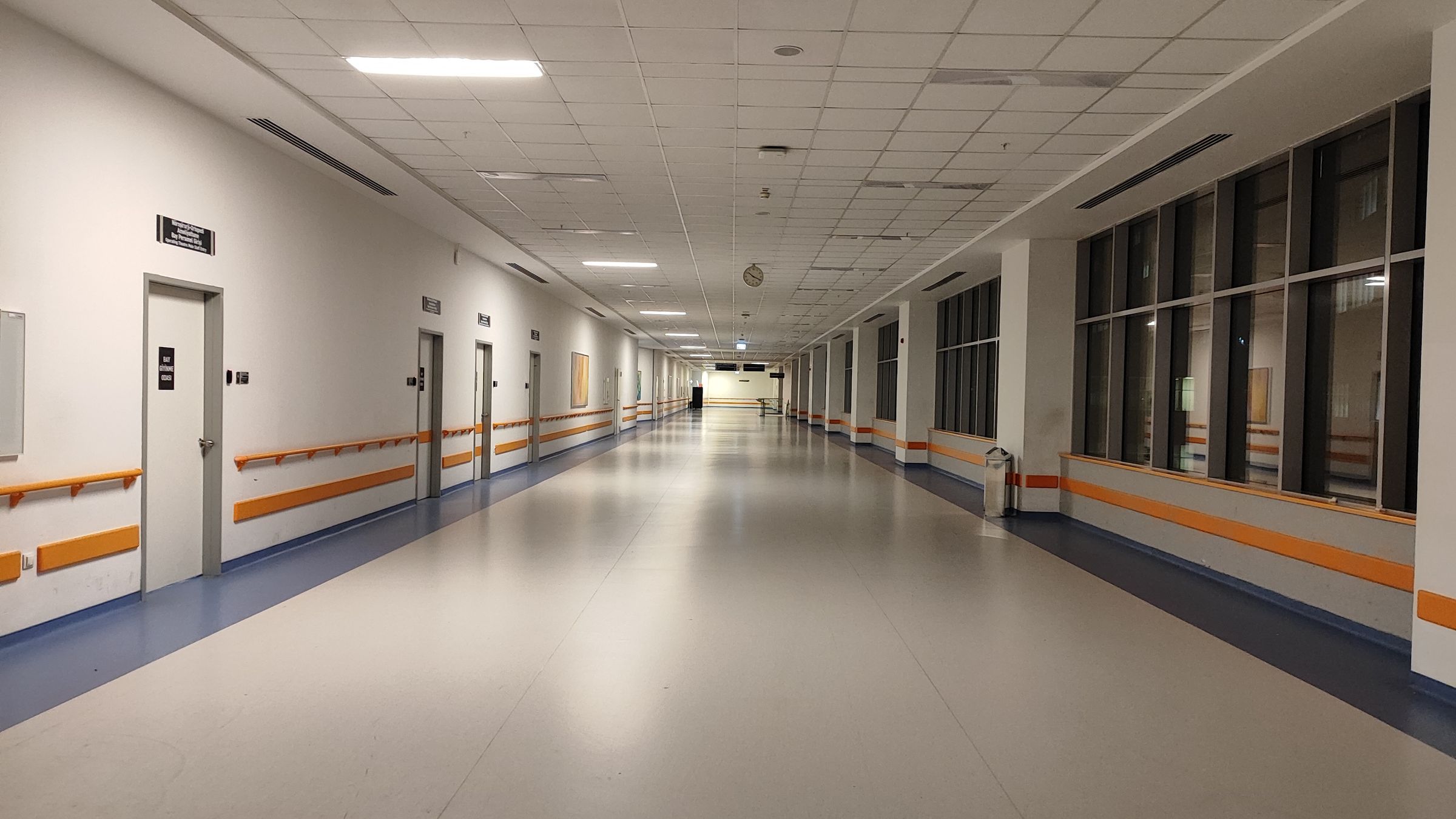 Modern hospital corridor with clean healthcare flooring