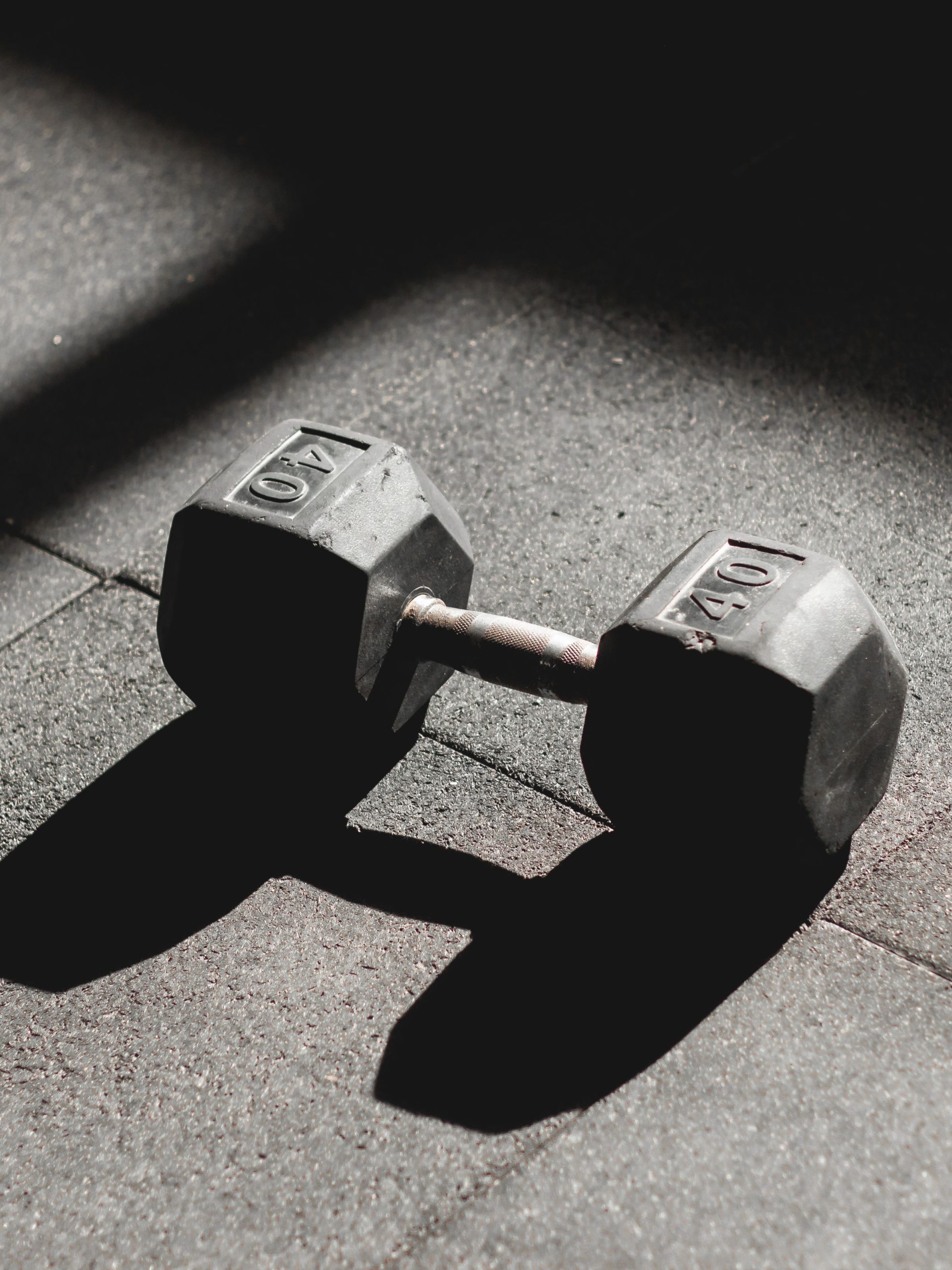 Dumbbell on textured rubber gym flooring
