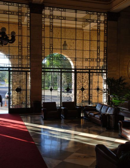 Elegant hotel lobby with sunlit marble flooring